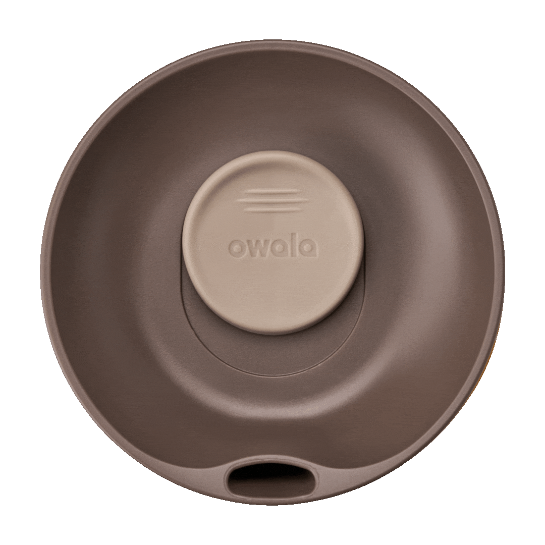 Owala SmoothSip Slider 20oz in Out of Sight, top-down lid view showing dark brown lid with tan slider button featuring owala wordmark and sip hole exposed