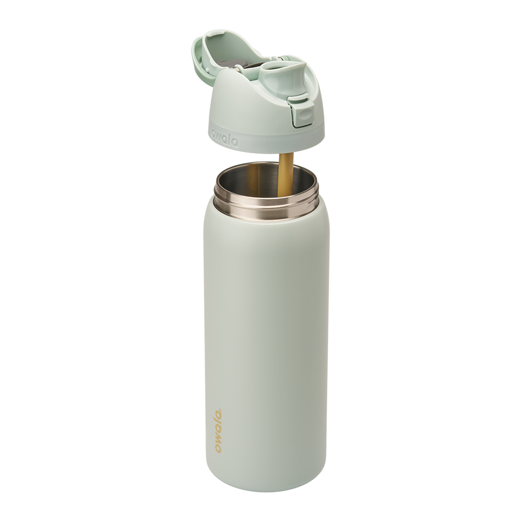 Owala FreeSip 32oz in Summer Paradise, exploded view with sage green insulated stainless steel body open at the top revealing the stainless interior, lid assembly separated above showing mint green flip cap open and gold-toned straw